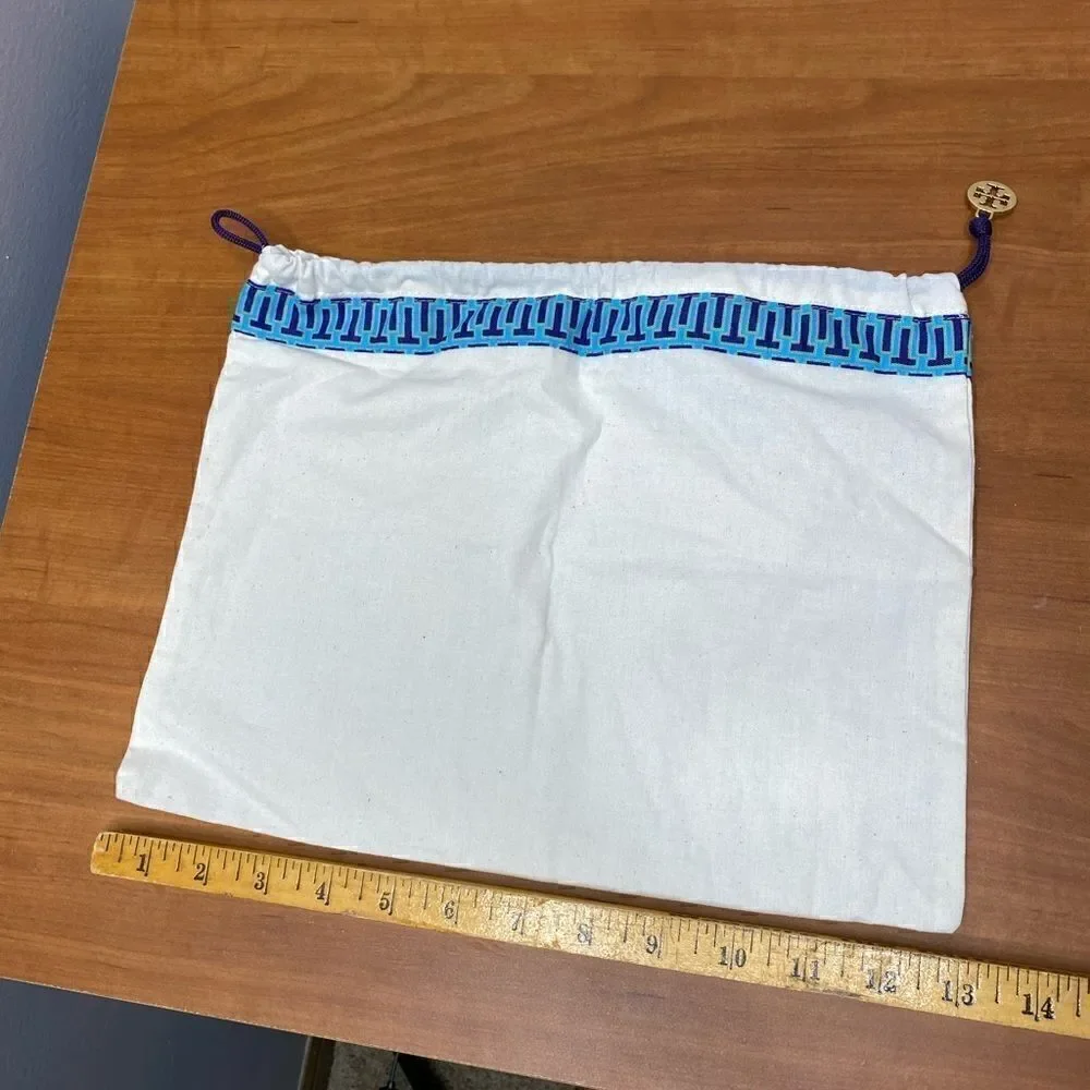 Tory Burch cream Dust bag with purple cord blue trim and gold signature hang tag